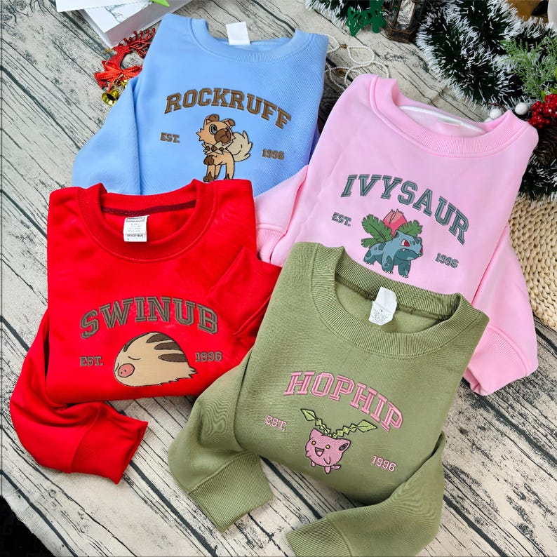 Custom embroidered Pokémon-inspired sweatshirts in multiple colors