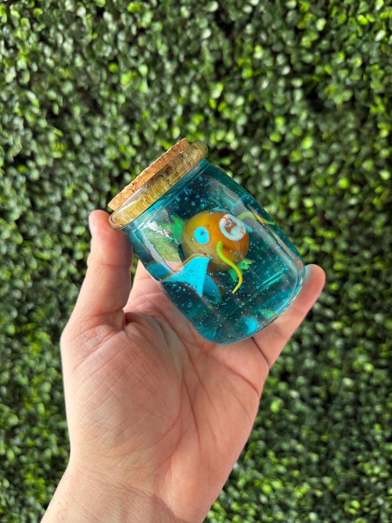 Magikarp-inspired 3D-printed fish displayed inside a corked glass bottle