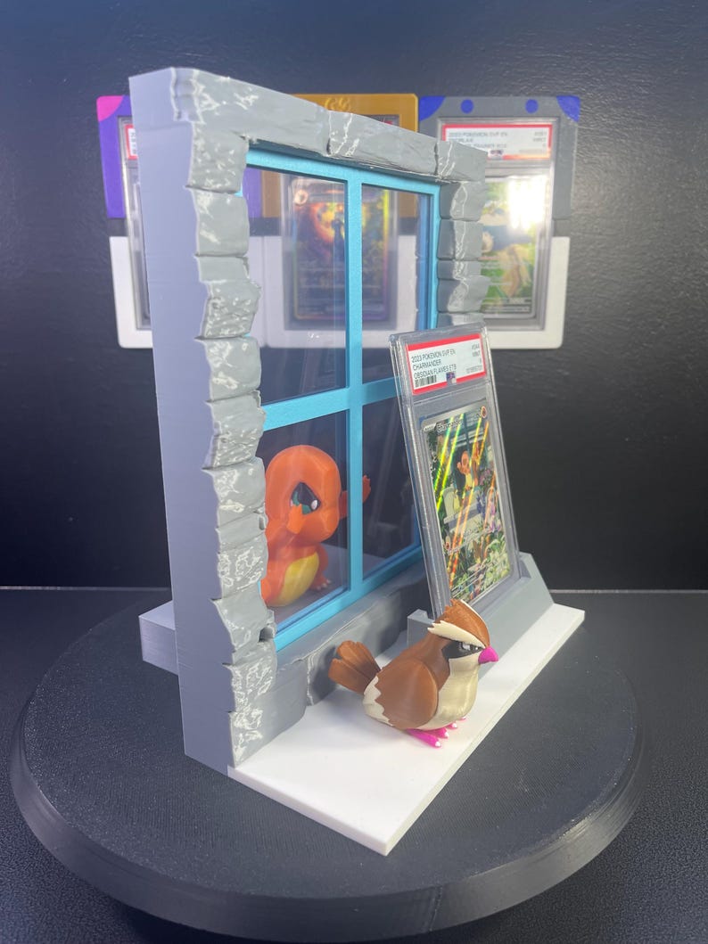Charmander and Pidgey graded-card window display product view 2
