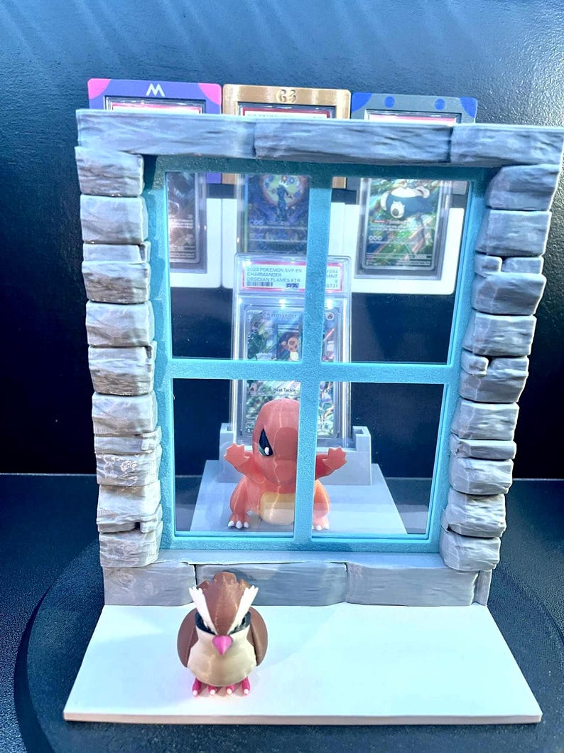 Charmander and Pidgey graded-card window display product view 5